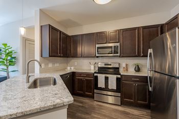 Renovated kitchen at the tribute apartments in raleigh, nc 27612